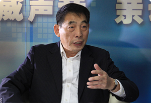 于連生:十年快速奔跑后的房地產圍城